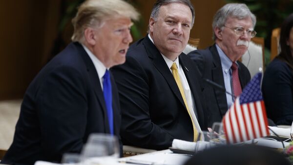 Secretary of State Mike Pompeo, center, and national security adviser John Bolton, right, listen as President Donald Trump speaks during a meeting with Vietnamese Prime Minister Nguyen Xuan Phuc at the Office of Government Hall, Wednesday, Feb. 27, 2019, in Hanoi - Sputnik International