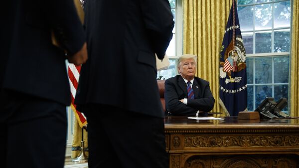 President Trump at his desk by the telephone, file photo. - Sputnik International
