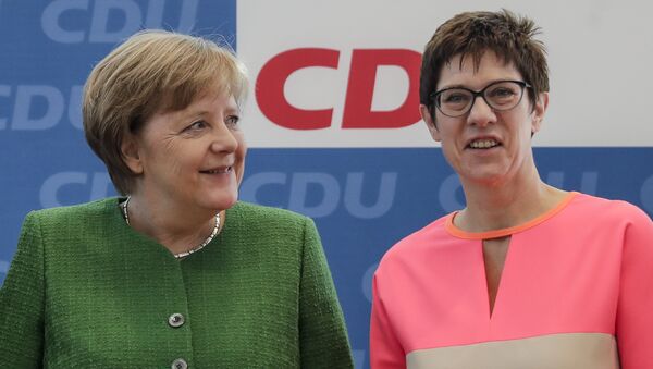 German Chancellor Angela Merkel, left, and the governor of German Saarland state and designated Christian Democratic Union party General Secretary, Annegret Kramp-Karrenbauer, right, attend a party leaders' meeting in Berlin, Germany. 19 February, 2018  - Sputnik International