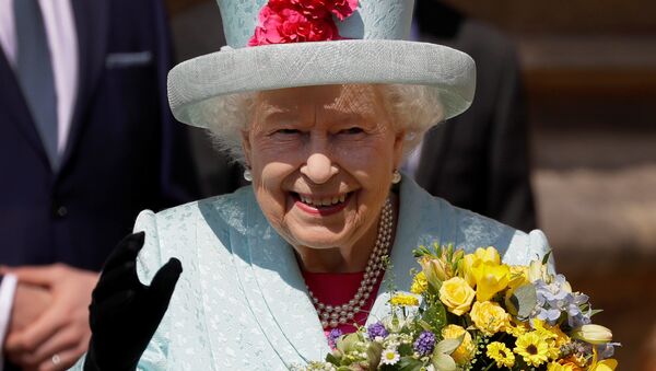 Britain's Queen Elizabeth waves to the public as she leaves the Easter Mattins Service at St George's Chapel at Windsor Castle, Britain April 21, 2019. - Sputnik International
