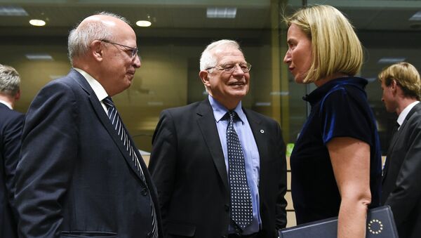 Portuguese Foreign Minister Augusto Santos Silva (L) speaks with Spanish Foreign Minister Josep Borrell (C) speak with EU's High Representative for Foreign Affairs and Security Policy Federica Mogherini during a EU Foreign Affairs Council meeting at the EU headquarters in Brussels on May 13, 2019. - Sputnik International