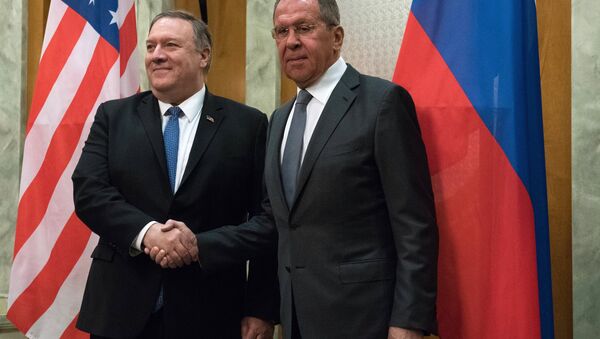 U.S. Secretary of State Mike Pompeo and Russian Foreign Minister Sergey Lavrov shake hands as they pose for a photo prior to their talks in the Black Sea resort city of Sochi, Russia, May 14, 2019 - Sputnik International