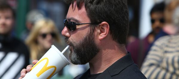 UK Independence Party (UKIP) European Election candidate Carl Benjamin, known by the online pseudonym Sargon of Akkad, drinks a McDonald's drink at a campaigning event in Exeter, southwest England, on May 13, 2019 - Sputnik International