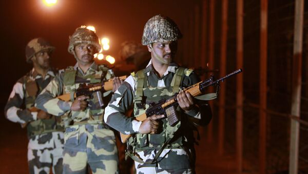 Indian Border Security Force (BSF) soldiers stand guard during a night patrol near the India Pakistan border fencing at Suchet Garh in Ranbir Singh Pura, about 27 kilometers (17 miles) south of Jammu, India, Wednesday, Jan. 17, 2018 - Sputnik International