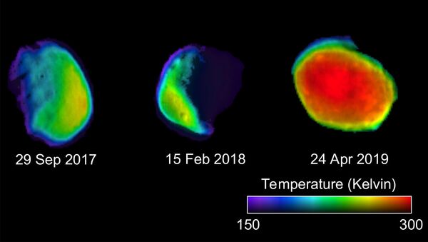 These three views of the Martian moon Phobos were taken by NASA's 2001 Mars Odyssey orbiter using its infrared camera, THEMIS. Each color represents a different temperature range. Credit: NASA - Sputnik International