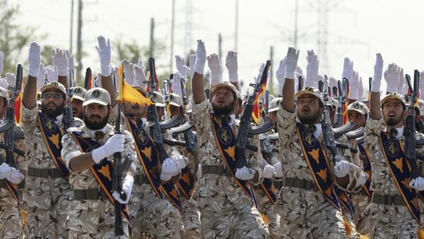 In this Sept. 22, 2011 file photo, Iran's Revolutionary Guard members march during armed forces parade marking the anniversary of the start of the 1980-88 Iraq-Iran war, in front of the shrine of the late revolutionary founder Ayatollah Khomeini, just outside Tehran, Iran - Sputnik International