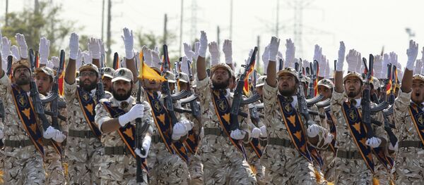 In this Sept. 22, 2011 file photo, Iran's Revolutionary Guard members march during armed forces parade marking the anniversary of the start of the 1980-88 Iraq-Iran war, in front of the shrine of the late revolutionary founder Ayatollah Khomeini, just outside Tehran, Iran - Sputnik International