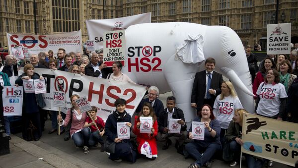 Demonstrators against HS2 pose outside the UK Parliament in 2014 with a giant white elephant - Sputnik International