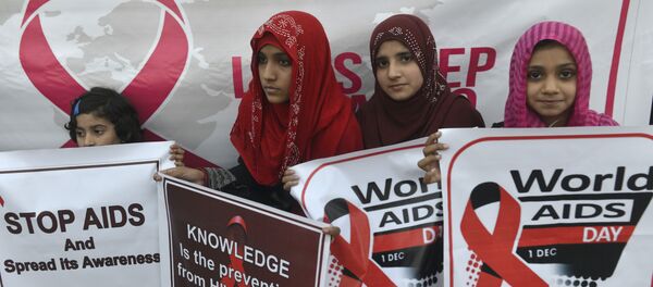Pakistani social activists carry placards during a rally to raise awareness on World AIDS Day in Lahore on December 1, 2016 Pakistani social activists carry placards during a rally to raise awareness on World AIDS Day in Lahore on December 1, 2016 - Sputnik International