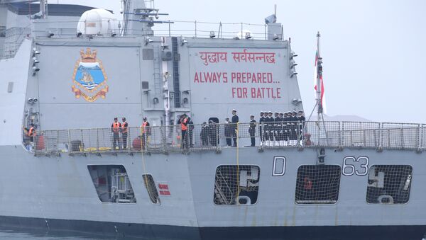 A slogan is seen on the back of the Indian navy commissioned warship INS Kolkata as it arrives at Qingdao Port for the 70th anniversary celebrations of the founding of the Chinese People's Liberation Army Navy (PLAN), in Qingdao, China April 21, 2019 - Sputnik International