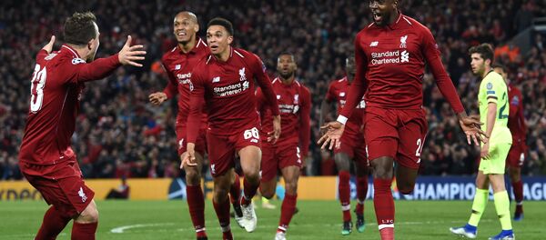 Divock Origi (far right) celebrates his winning goal against Barcelona with Liverpool team-mates - Sputnik International
