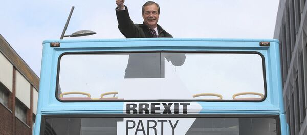 Brexit Party leader Nigel Farage gestures on an open topped bus while on the European Election campaign trail in Sunderland, England, Saturday, May 11, 2019 - Sputnik International