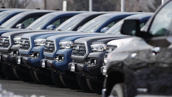 In this Wednesday, Feb. 27, 2019, file photograph, a long row of unsold 2019 Tacoma pickup trucks sits at a Toyota dealership in Lakewood, Colo. On Wednesday, March 13, the Commerce Department releases its January report on durable goods - Sputnik International