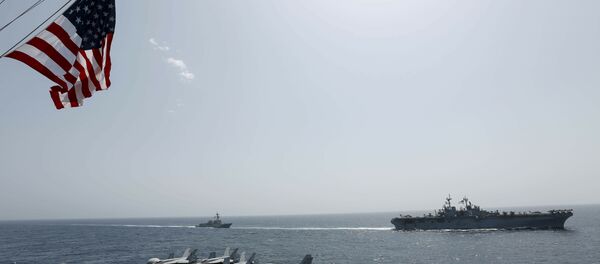 In this Friday, May 17, 2019, photo, released by the U.S. Navy, the amphibious assault ship USS Kearsarge, right, and the Arleigh Burke-class guided-missile destroyer USS Bainbridge, left, are seen from the Nimitz-class aircraft carrier USS Abraham Lincoln as they sail in the Arabian Sea In this Friday, May 17, 2019, photo, released by the U.S. Navy, the amphibious assault ship USS Kearsarge, right, and the Arleigh Burke-class guided-missile destroyer USS Bainbridge, left, are seen from the Nimitz-class aircraft carrier USS Abraham Lincoln as they sail in the Arabian Sea - Sputnik International