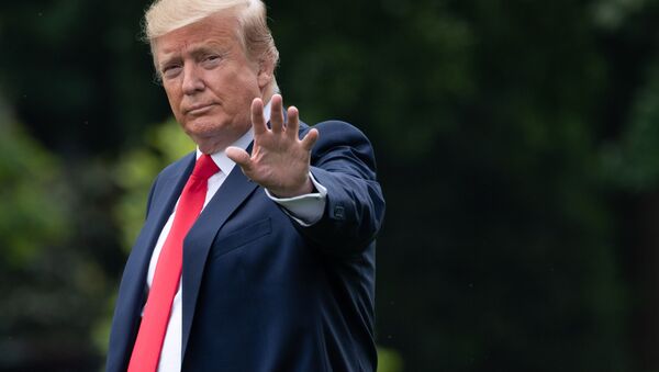 (FILES) In this file photo taken on May 8, 2019, US President Donald Trump waves as he walks to Marine One prior to departing from the South Lawn of the White House in Washington, DC, May 8, 2019 - Sputnik International