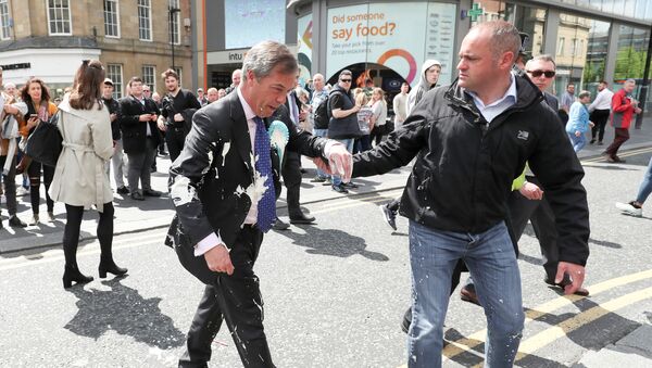 Brexit Party leader Nigel gestures after being hit with a milkshake while arriving for a Brexit Party campaign event in Newcastle, Britain, May 20, 2019 - Sputnik International
