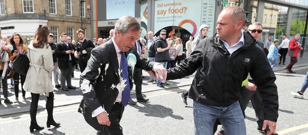 Brexit Party leader Nigel gestures after being hit with a milkshake while arriving for a Brexit Party campaign event in Newcastle, Britain, May 20, 2019 - Sputnik International