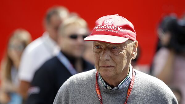 FILE - In this July 7, 2018 file photo former Formula One World Champion Niki Lauda of Austria walks in the paddock before the third free practice at the Silverstone racetrack, Silverstone, England. Niki Lauda hopes to “soon” be back working with Mercedes as he continues his recovery from a lung transplant. The three-time Formula One champion was smiling and cheery as he posted a message on the Mercedes team’s Twitter account on Saturday, Nov. 24. (AP Photo/Luca Bruno, file) - Sputnik International