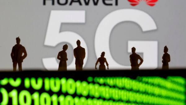 Small toy figures are seen in front of a displayed Huawei and 5G network logo in this illustration picture, March 30, 2019 - Sputnik International