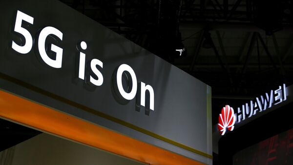 A Huawei logo is seen at an exhibition during the World Intelligence Congress in Tianjin, China May 16, 2019 - Sputnik International
