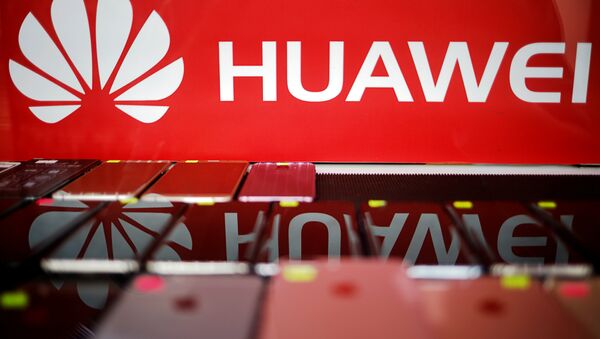 The logo of Huawei is pictured at a mobile phone shop in Singapore, May 21, 2019 - Sputnik International