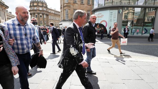 Brexit Party leader Nigel gestures after being hit with a milkshake while arriving for a Brexit Party campaign event in Newcastle, Britain, May 20, 2019 - Sputnik International