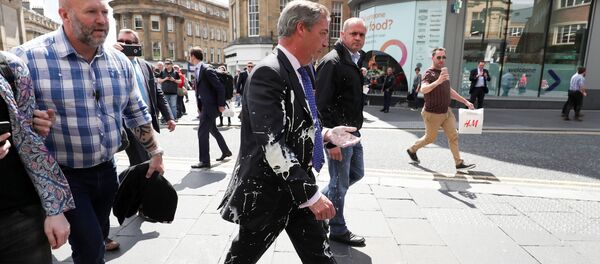 Brexit Party leader Nigel gestures after being hit with a milkshake while arriving for a Brexit Party campaign event in Newcastle, Britain, May 20, 2019 - Sputnik International
