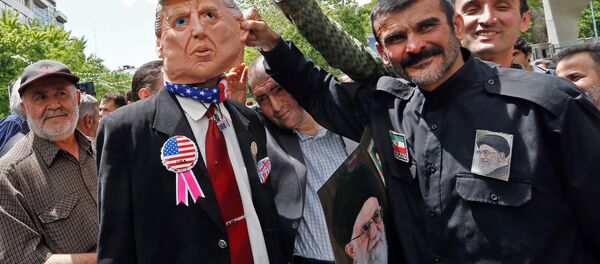 Iranian demonstrators carry a portrait of Iran's Supreme Leader Ayatollah Ali Khamenei and an effigy of US President Donald Trump during a rally in the capital Tehran, on May 10 2019 Iranian demonstrators carry a portrait of Iran's Supreme Leader Ayatollah Ali Khamenei and an effigy of US President Donald Trump during a rally in the capital Tehran, on May 10 2019 - Sputnik International