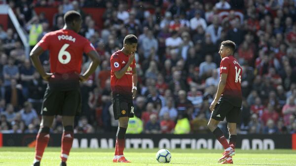 Manchester United's Paul Pogba, Marcus Rashford and Jesse Lingard react to defeat to Cardiff in the last game of the season - Sputnik International