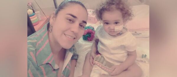 Yelibeth, Isabella’s mother, was able to donate her liver to her daughter, but the success of the operation in Argentina is at risk because the US froze the accounts of Citgo, a subsidiary of Venezuela’s state-run PDVSA oil giant, that funded such complex medical treatment abroad. Yelibeth, Isabella’s mother, was able to donate her liver to her daughter, but the success of the operation in Argentina is at risk because the US froze the accounts of Citgo, a subsidiary of Venezuela’s state-run PDVSA oil giant, that funded such complex medical treatment abroad. - Sputnik International