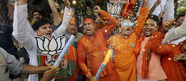 Bharatiya Janata Party (BJP) workers celebrate outside BJP headquarters in New Delhi India, Thursday, May 23, 2019 Bharatiya Janata Party (BJP) workers celebrate outside BJP headquarters in New Delhi India, Thursday, May 23, 2019 - Sputnik International