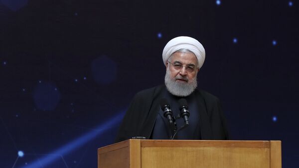 In this photo released by the official website of the office of the Iranian Presidency, President Hassan Rouhani speaks during a ceremony commemorating National Day of Nuclear Technology in Tehran, Iran, Tuesday, April 9, 2019 - Sputnik International