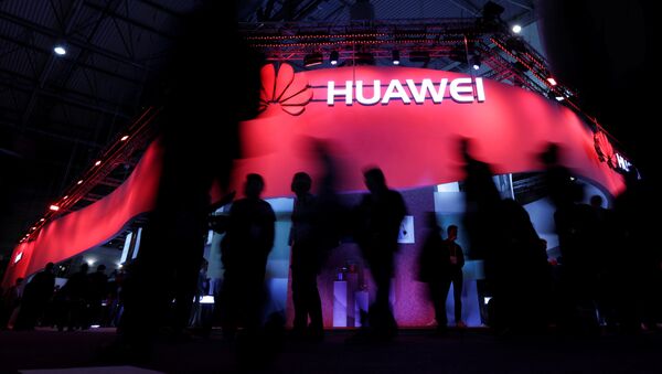 Visitors walk past Huawei's booth during Mobile World Congress in Barcelona, Spain, February 27, 2017 - Sputnik International