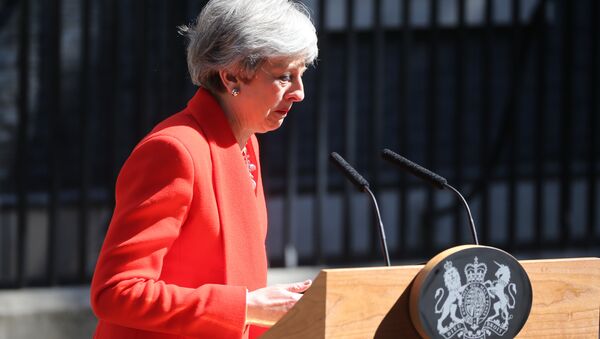 Britain's Prime Minister Theresa May reacts as she announces her resignation outside 10 Downing street in central London on May 24, 2019. - Sputnik International