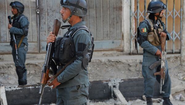 Afghan policemen stand guard at the site of a bomb attack near a mosque in Kabul (File) - Sputnik International