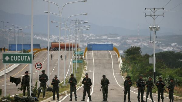 Venezuelan Bolivarian Army soldiers stand guard at the Tienditas International Bridge that links Colombia and Venezuela, near Urena, Venezuela, Friday, Feb. 8, 2019. - Sputnik International