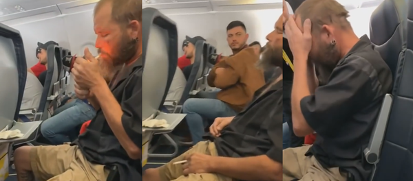 Seemingly Intoxicated Passenger Lights Cigarette on US Flight Seemingly Intoxicated Passenger Lights Cigarette on US Flight - Sputnik International