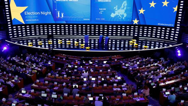 Exit poll results are displayed on a screen at the Plenary Hall during the election night for European elections at the European Parliament in Brussels, Belgium, May 26, 2019 - Sputnik International