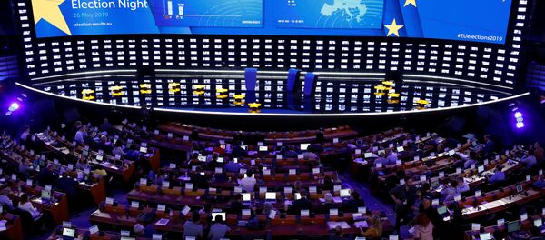 Exit poll results are displayed on a screen at the Plenary Hall during the election night for European elections at the European Parliament in Brussels, Belgium, May 26, 2019 - Sputnik International