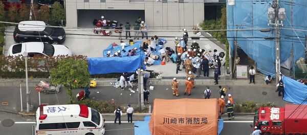 An aerial view shows rescue workers and police officers operate at the site where sixteen people were injured in a suspected stabbing by a man, in Kawasaki, Japan May 28, 2019 An aerial view shows rescue workers and police officers operate at the site where sixteen people were injured in a suspected stabbing by a man, in Kawasaki, Japan May 28, 2019 - Sputnik International