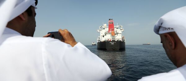 Port officials take a photo of a damaged Andrea Victory ship at the Port of Fujairah, United Arab Emirates, May 13, 2019 - Sputnik International