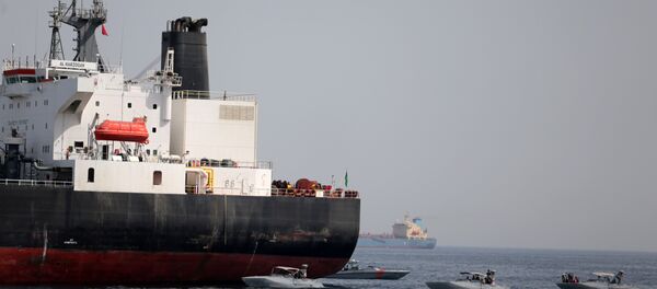 UAE Navy boats are seen next to the Saudi tanker Al Marzoqah off the Port of Fujairah, UAE, May 13, 2019 - Sputnik International