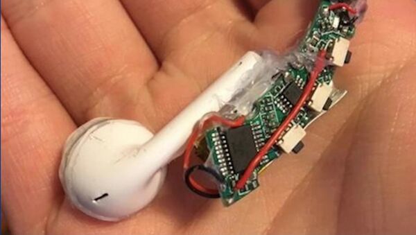 A 15-year-old Sam Cashbook made a working pair of DIY AirPods using an old pair of headphones and a soldering iron. - Sputnik International