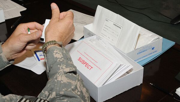 Medical professionals learn how to use the Sexual Assault Evidence Collection kit at Camp Phoenix near Kabul, Afghanistan, Aug. 15, 2010. The kit has several packets to collect evidence from a suspect and a patient of a sexual assault case. - Sputnik International