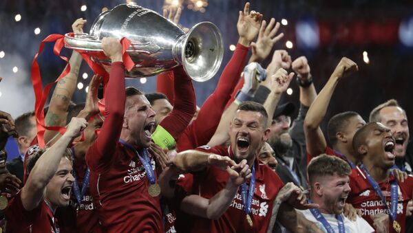 Liverpool's players celebrate with the trophy after winning the Champions League final soccer match between Tottenham Hotspur and Liverpool at the Wanda Metropolitano Stadium in Madrid, Sunday, June 2, 2019. Liverpool won 2-0. - Sputnik International