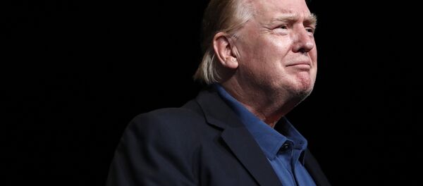 President Donald Trump looks out at the crowd after being prayed for at McLean Bible Church, in Vienna, Va., Sunday June 2, 2019 - Sputnik International