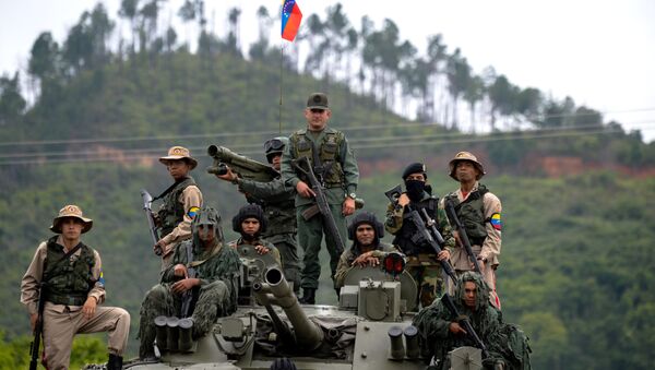 Venezuelan troops in different fatigues and carrying various weapons stand on a Russian-made BMP-3M IFV during the press conference given by Defence Minister general Vladimir Padrino Lopez at Fort Tiuna in Caracas on August 14, 2017 - Sputnik International