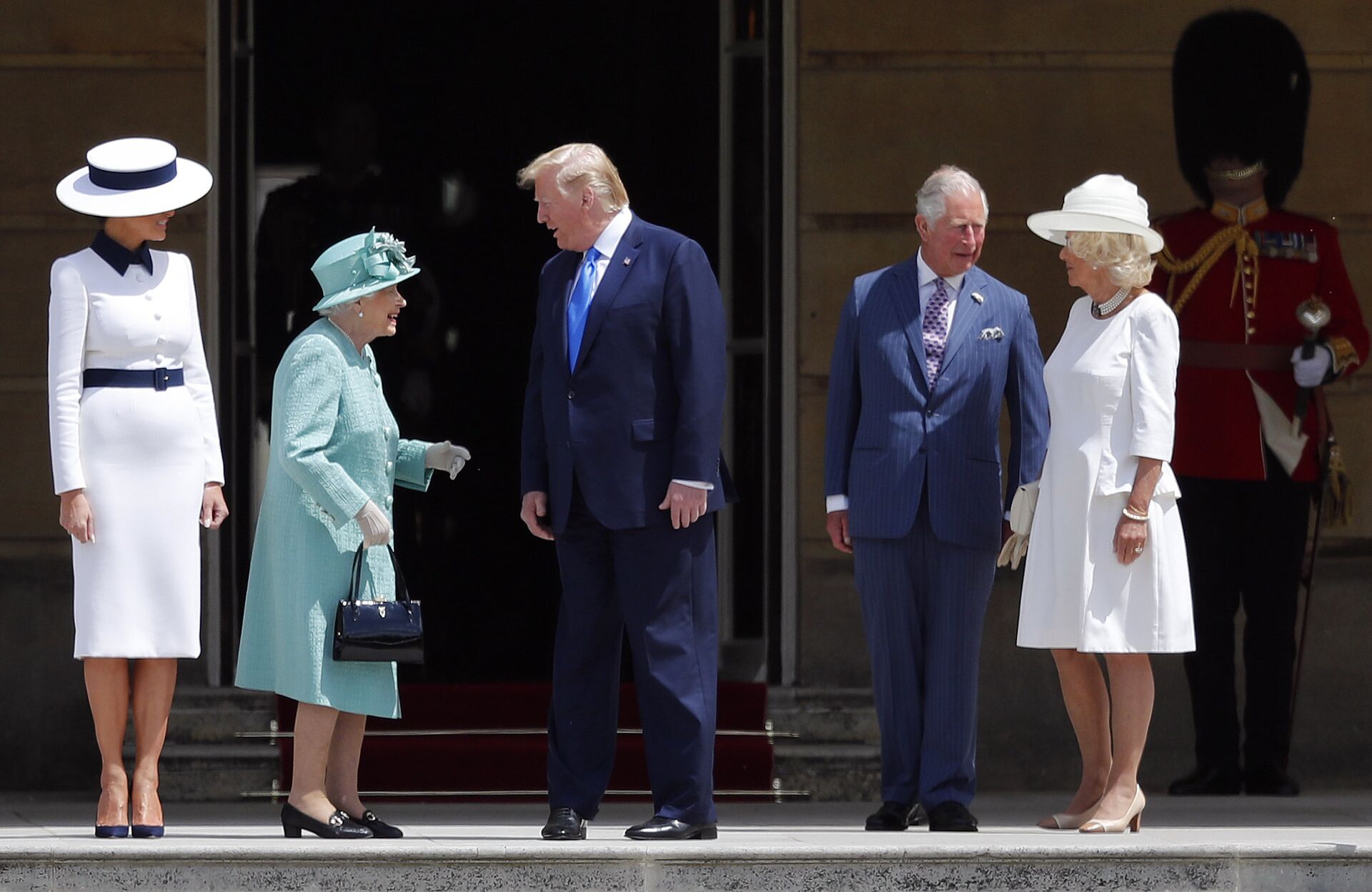 Britain's Queen Elizabeth II greets President Donald Trump, center, and first lady Melania Trump, left, with Britain's Prince Charles and Camilla, Duchess of Cornwall during a ceremonial welcome in the garden of Buckingham Palace in London, Monday, June 3, 2019 on the opening day of a three day state visit to Britain - Sputnik International, 1920, 06.10.2021