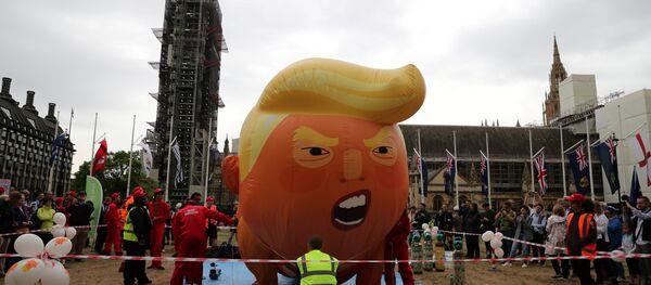 A Baby Trump balloon inflates, during a protest in London, Britain, June 4, 2019 - Sputnik International