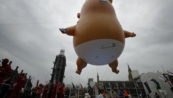 The 'Trump Baby' blimp is inflated in Parliament Square in central London as people start to gather to demonstrate against the state visit of President Donald Trump, Tuesday, June 4, 2019 - Sputnik International